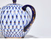 Close-up of the Cobalt Net Tulip teapot handle and gold decoration